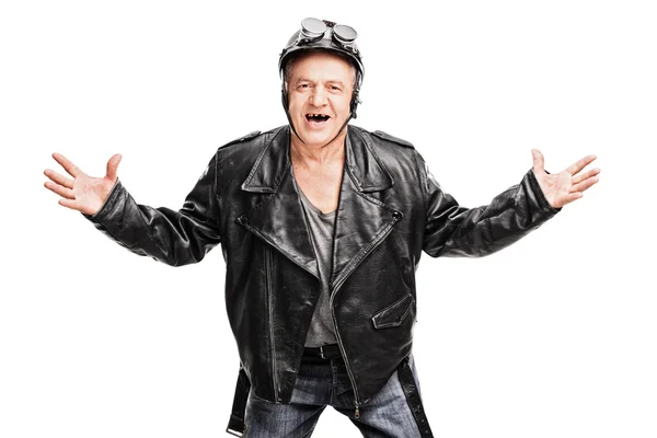 Mature biker gesturing with his hands — Stock Photo, Image