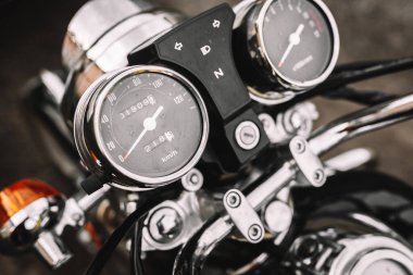 Motorcycle detail with speedometer. Chrome motorcycle details closeup. 