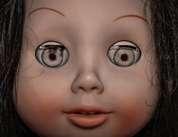 Creepy scary old vintage doll face with black hair smiling