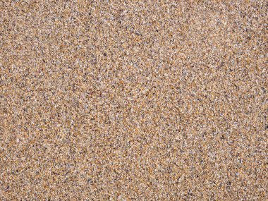 Golden beach sand texture background.