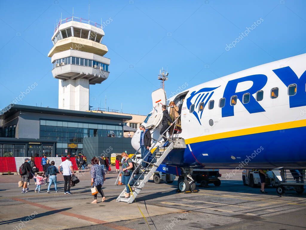 Timisoara, Romania - 06.19.2021: People getting off from a Ryanair plane at Timisoara Traian Vuia International Airport