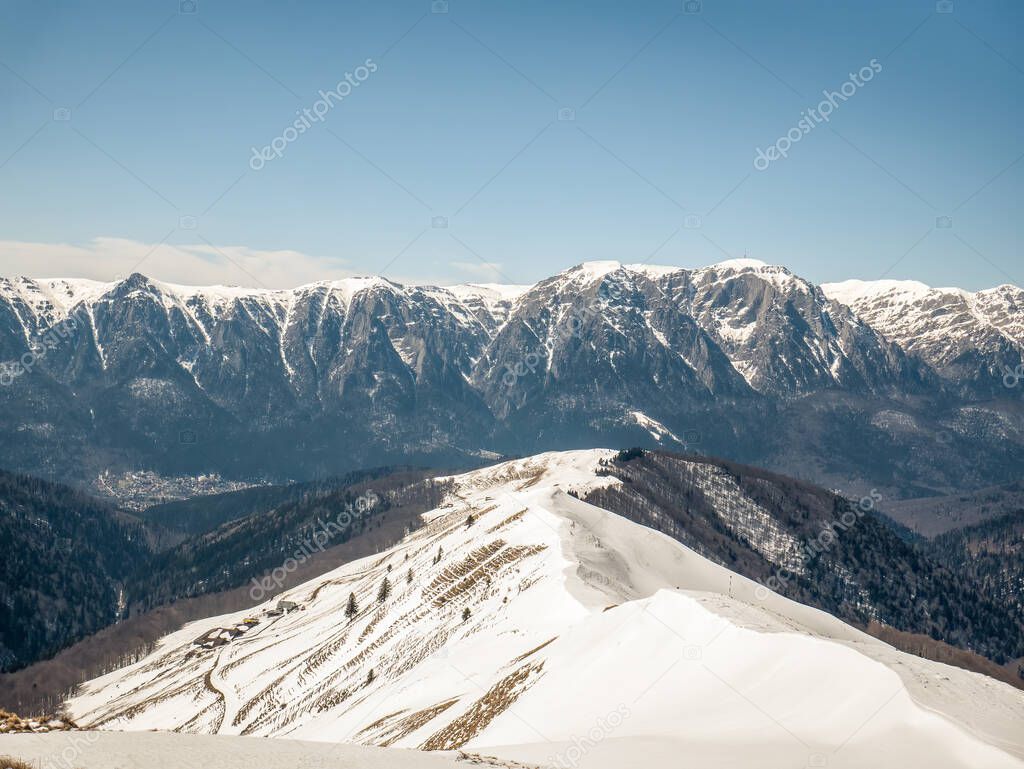 Bucegi Mountain range covered in snow in Romania. Winter landscape