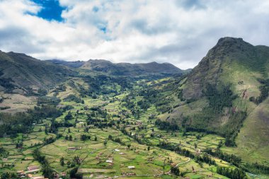 Scenic landscape view of the lush, green Sacred Valley in Peru, taken from the Archaeological site of Pisac