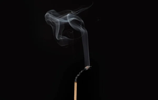 Ignition of match with smoke, isolated on black background — Stock Photo, Image