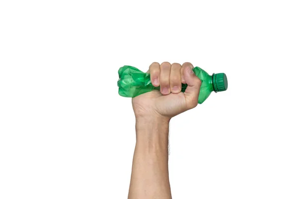 Plastik şişe geri dönüşümü ya da kirlilik konsepti. Beyaz arka planda izole edilmiş yeşil bir plastik şişeyi sıkmak ya da kırmak