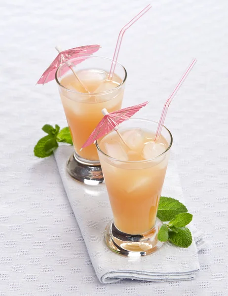 Cocktail with umbrella ice — Stock Photo, Image