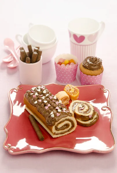 Festive biscuit roulade with chocolate cream — Stock Photo, Image