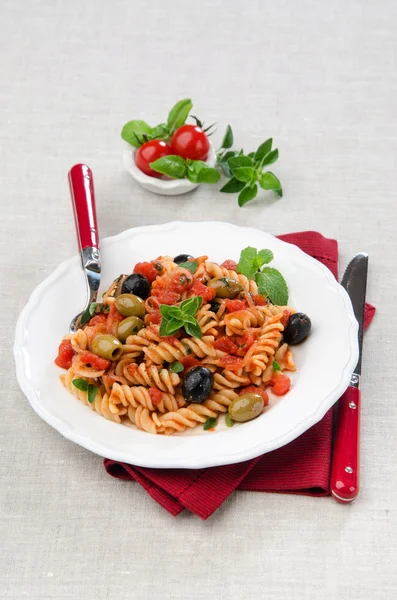 Fusilli with tomato olives and oregano — Stock Photo, Image