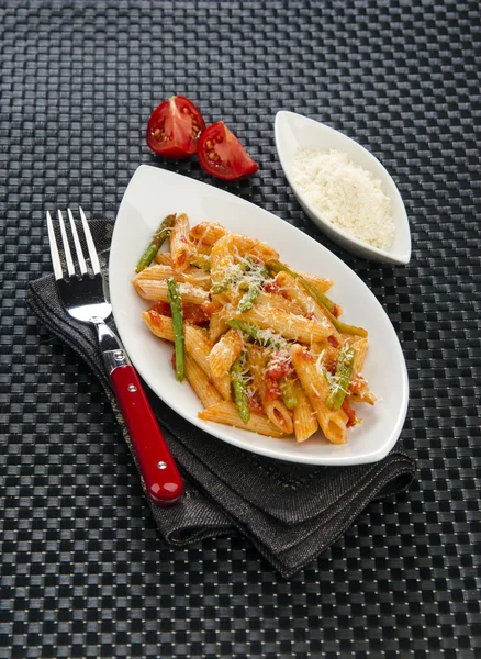 Penne pasta with parmesan cheese and vegetables — Stock Photo, Image