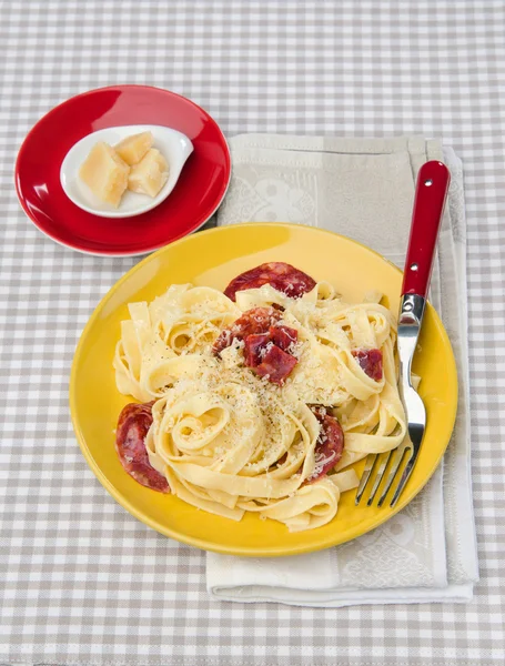 Tagliatelle with parmesan and chorizo — Stock Photo, Image