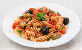 fusilli with tomato olives and oregano