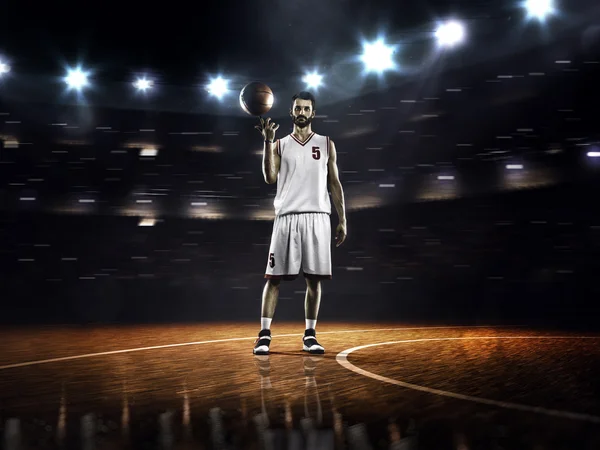 Basketbal speler draaiende bal — Stockfoto