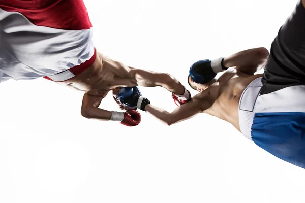 Two professionl boxers are fighting on the white — Stock Photo, Image