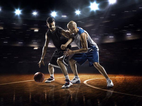 Two basketball players in action