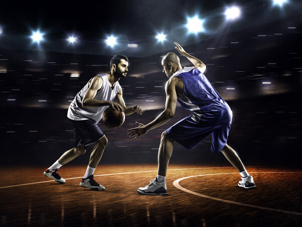 Two basketball players in action