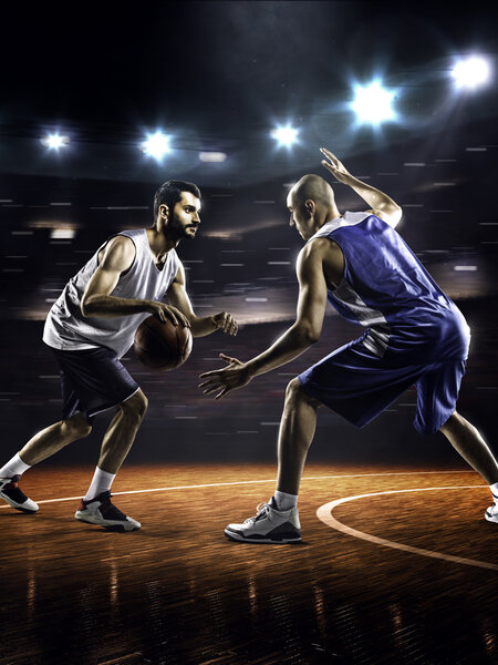 Two basketball players in action