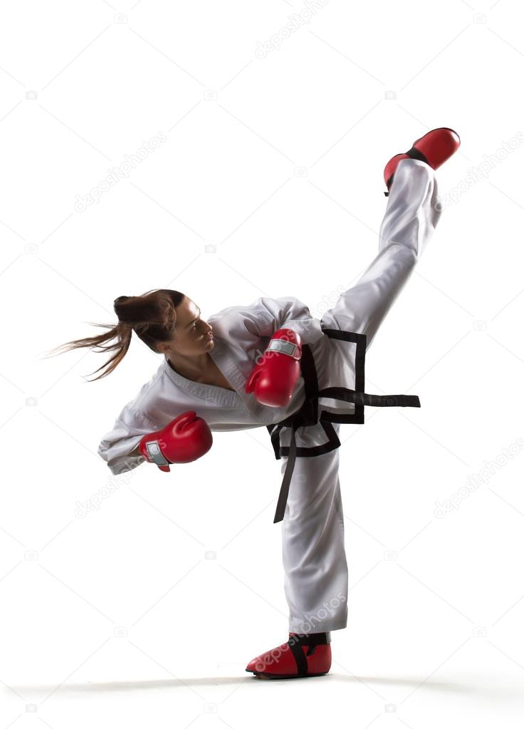 Professional female karate fighter isolated on white