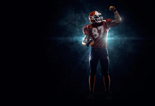 American football player in spotlight — Stock Photo, Image