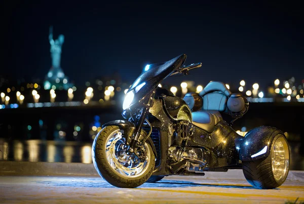 Black trike standing on the night street — Stock Photo, Image