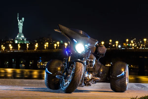 Black trike standing on the night street — Stock Photo, Image