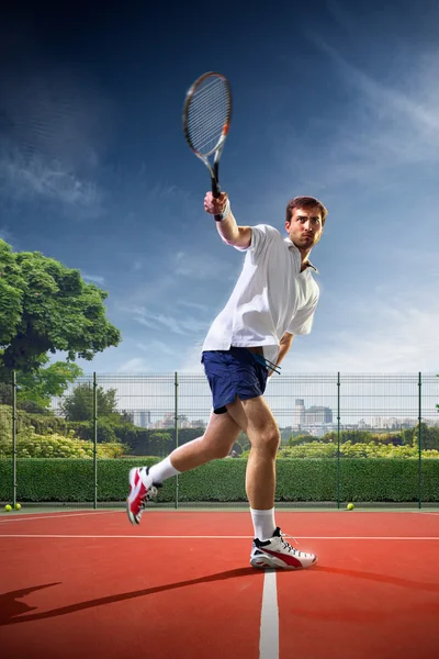 Young man is playing tennis — Stock Photo, Image