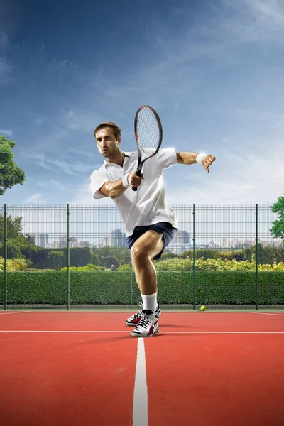Young man is playing tennis — Stock Photo, Image