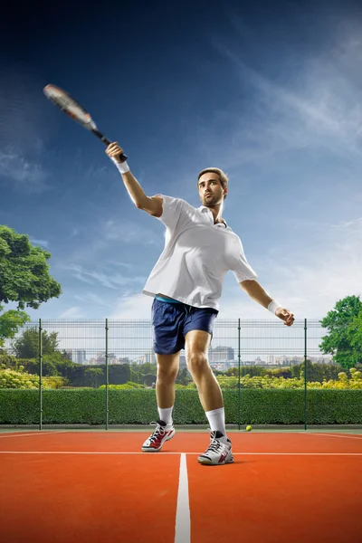 Young man is playing tennis — Stock Photo, Image