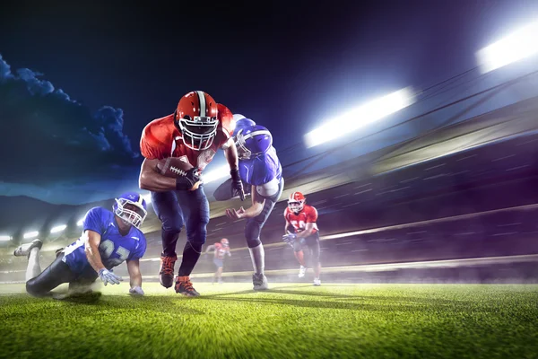 American football players in action on grand arena — Stock Photo, Image