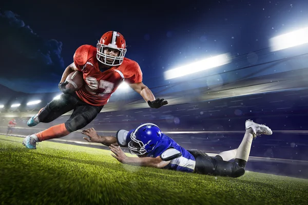 American football players in action on grand arena — Stock Photo, Image