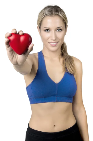 Young happy sporty girl showing heart — Stock Photo, Image