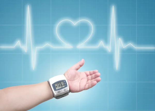 Blood pressure meter on man wrist — Stock Photo, Image