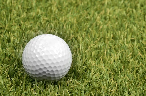 Golf ball on course with green grass. — Stock Photo, Image