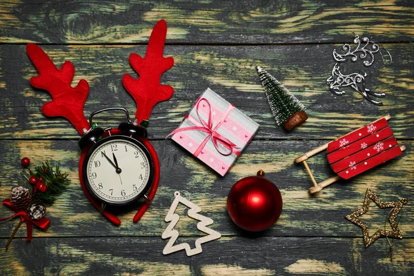 Christmas decorations and clocks showing five to twelve — Stock Photo, Image