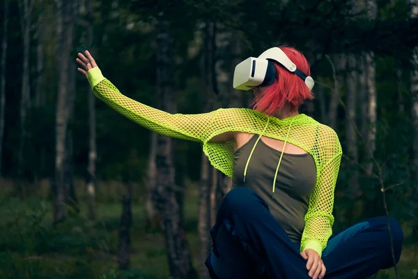 Woman goes into virtual reality using virtual reality headset.