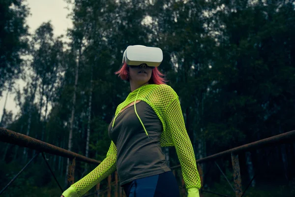 Woman goes into virtual reality using virtual reality headset.