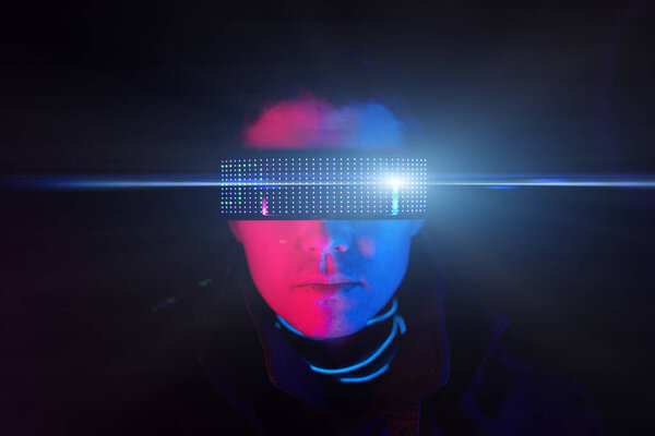 Cyberpunk style portrait of man in futuristic costume.