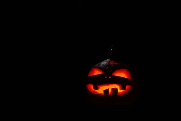 Pumpkin with burning mouths and eyes on blank black background. Jack-o-lantern decoration. — Stock Photo, Image