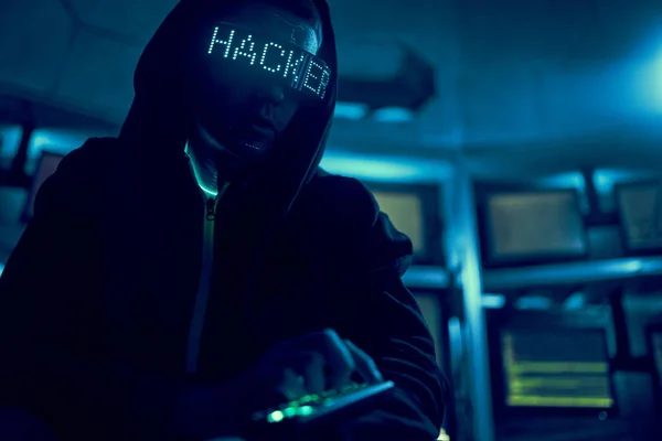 Cyber hacker breaks into databases to obtain information using a computer. — Stock Photo, Image