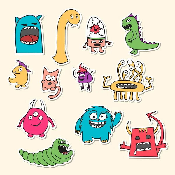 Aantal stickers met doodle monsters. — Stockvector