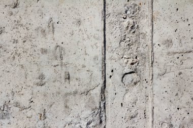 Bloklardan yapılmış gri renkli beton duvarın desen fotoğrafı.