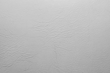 Beyaz ya da açık gri renkli deri yüzey arkaplanının desen fotoğrafı.