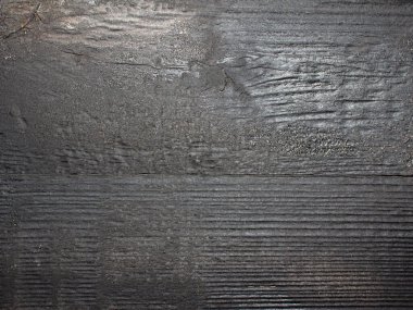 Fırçalanmış ve yanmış tahta yüzeyin doku fotoğrafı..