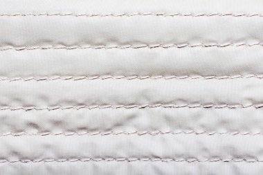 Bologna kumaş dikişli doku yüzeyi, beyaz renkli malzeme.