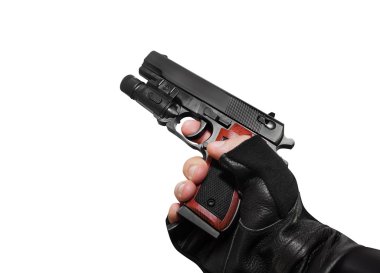 Bir tabanca profil görünümü tutan el.