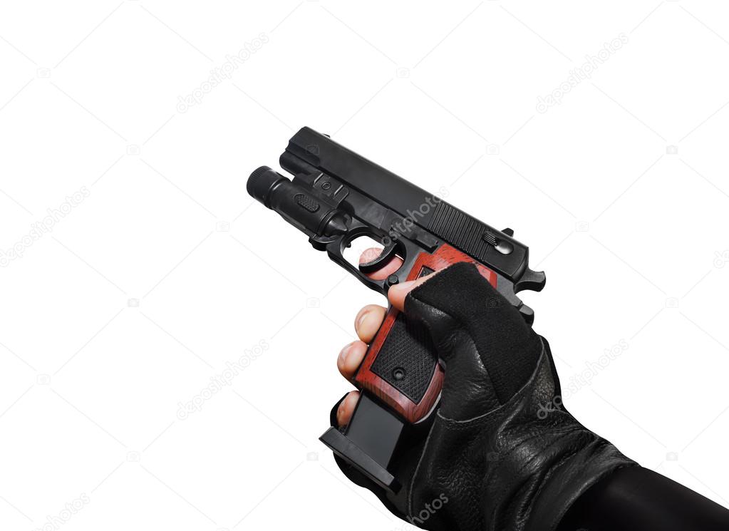 Hand holding a handgun with clip view.