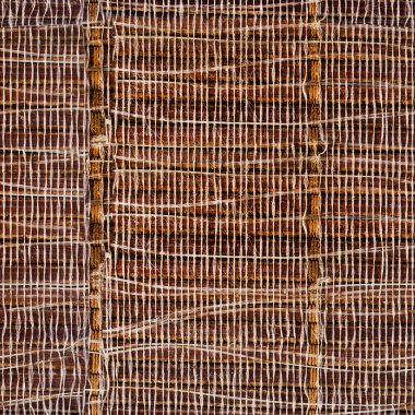 Örgü desenli yıpranmış bambu paspas yüzeyinin pürüzsüz 4k fotoğraf dokusu.