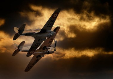 Curtis Hawk ve P40 savaş uçağı bir İngiliz hava gösterisinde sergileniyor. Gökyüzü eklendi.