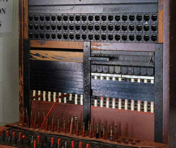 Panel of vintage analogue wired telephone exchange.