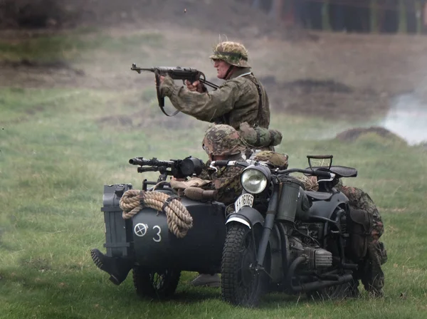 stock image Battlefield scene with men dressed in German second world war uniform. Motor cycle and sidecar.