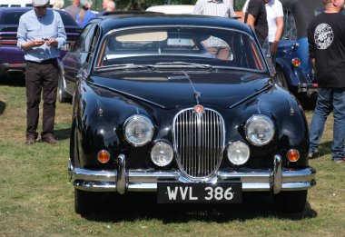 Scunthorpe, Lincolnshire, UK. August 2025. Warlock motorcycle club annual show with music, characters, cars and bikes. Vintage and modern. Customised and renovated.